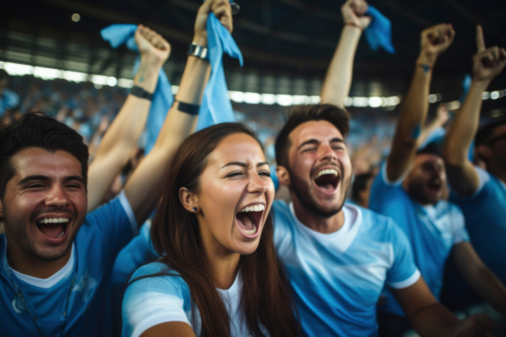 aficionados celebrando en un partido de fútbol soccer