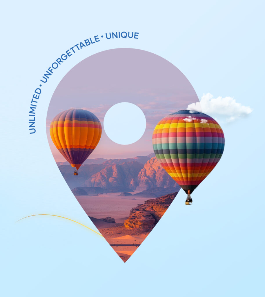 paisaje de montañas con globo aerostatico y nubes